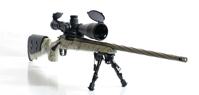custom long range rifle with scope, stand, and custom camo finish