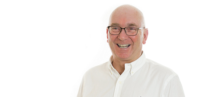 Mike Kane, VP of Manufacturing and Engineering for Ranch Hand standing in front of white background